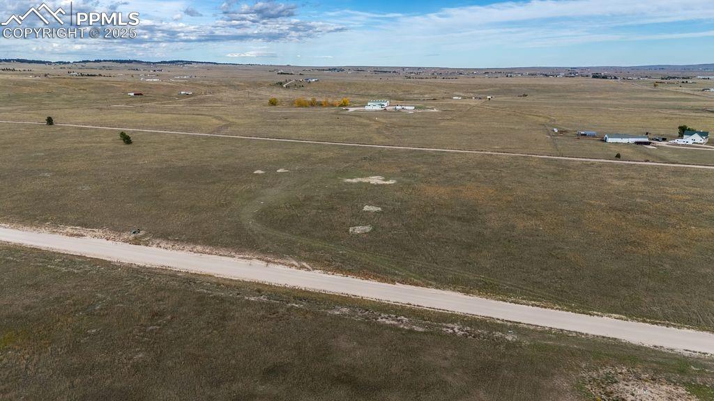 Image 7 of 11: Ariel view of building site and road.