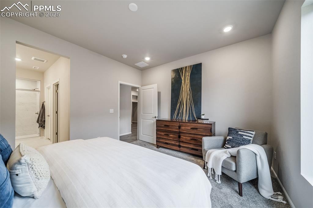 Image 17 of 25: Bedroom with carpet and recessed lighting