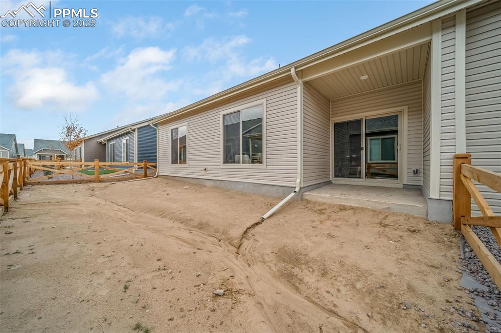 Image 25 of 25: Back of property featuring a patio