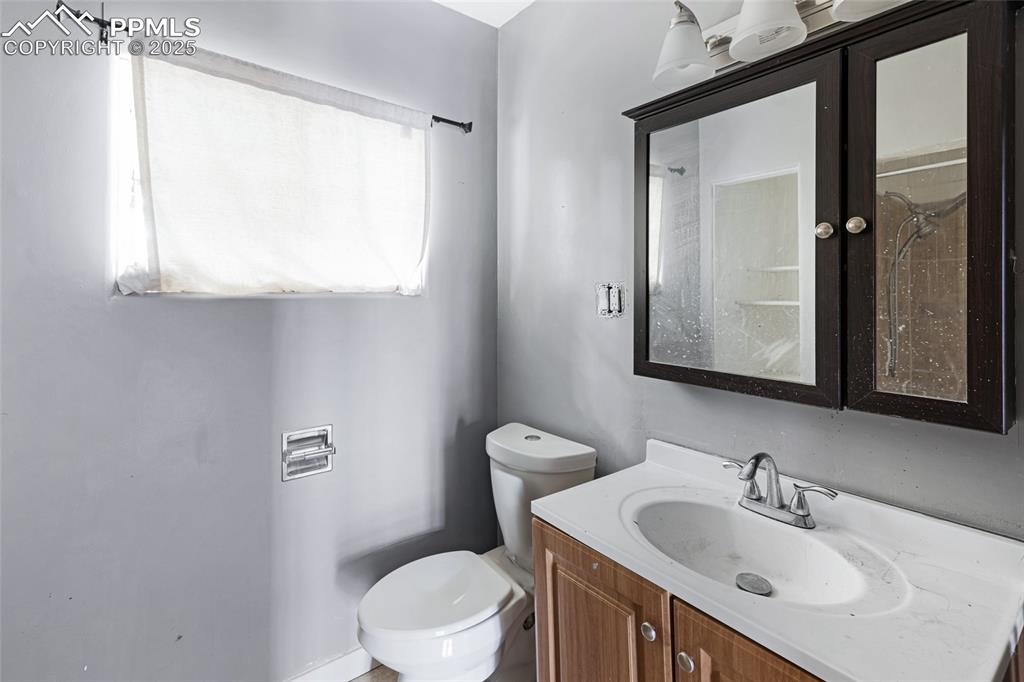 Image 12 of 16: Bathroom featuring vanity and toilet
