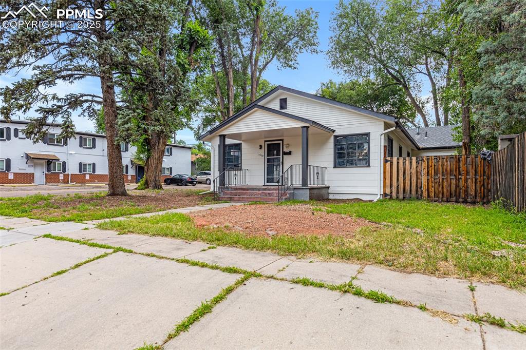 Image 2 of 16: Bungalow-style house featuring covered porch