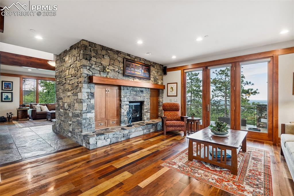 Image 13 of 50: Main level family room with access to outdoor living area