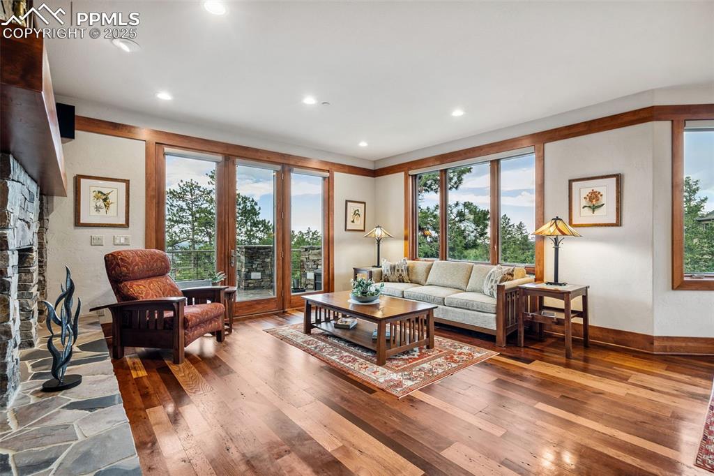 Image 14 of 50: Look at these gorgeous wood floors and scenery