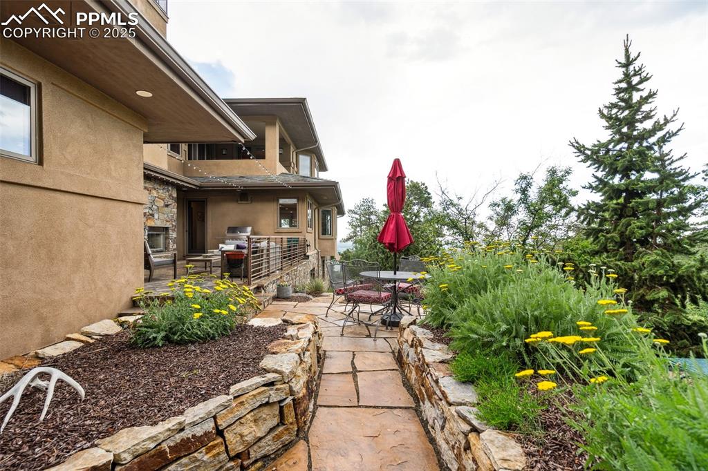 Image 46 of 50: New landscaping and lovely gardens this is also part of the back patio opti