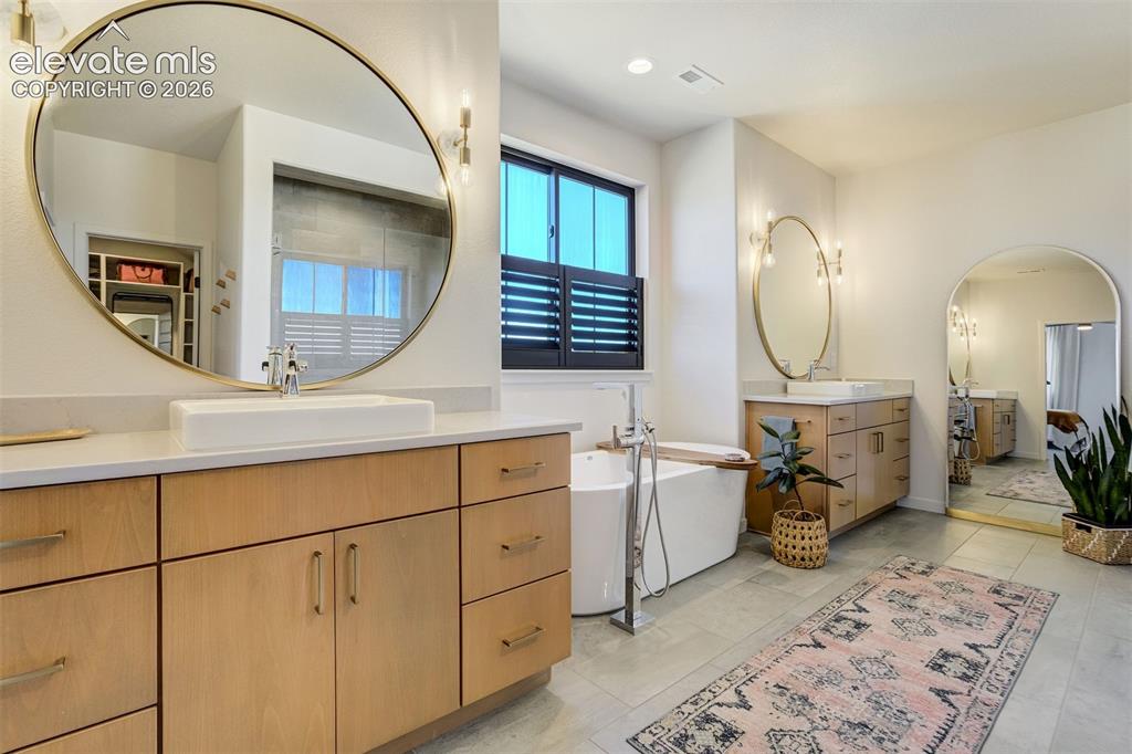 Image 25 of 50: Freestanding soaking tub with floor-mounted faucet