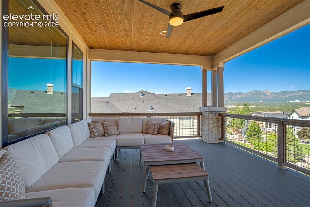 Image 42 of 50: Covered exterior deck featuring a wood-finish ceiling with an attached ceil