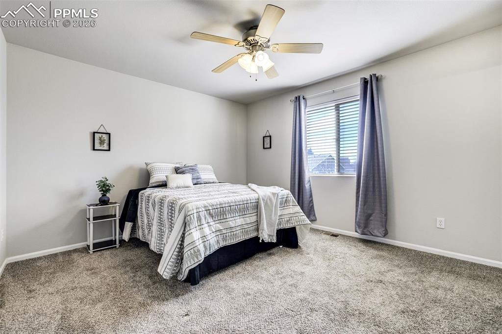 Image 18 of 33: Large primary bedroom with a walk-in closet.