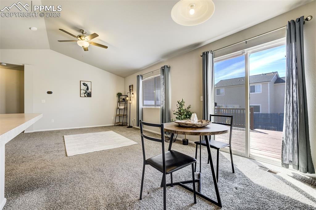 Image 8 of 33: Dining area leads out to a large deck. Great for BBQs.