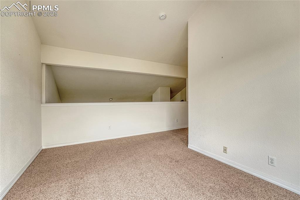 Image 26 of 47: Atop the stairs is the loft space that can be made into an office space or
