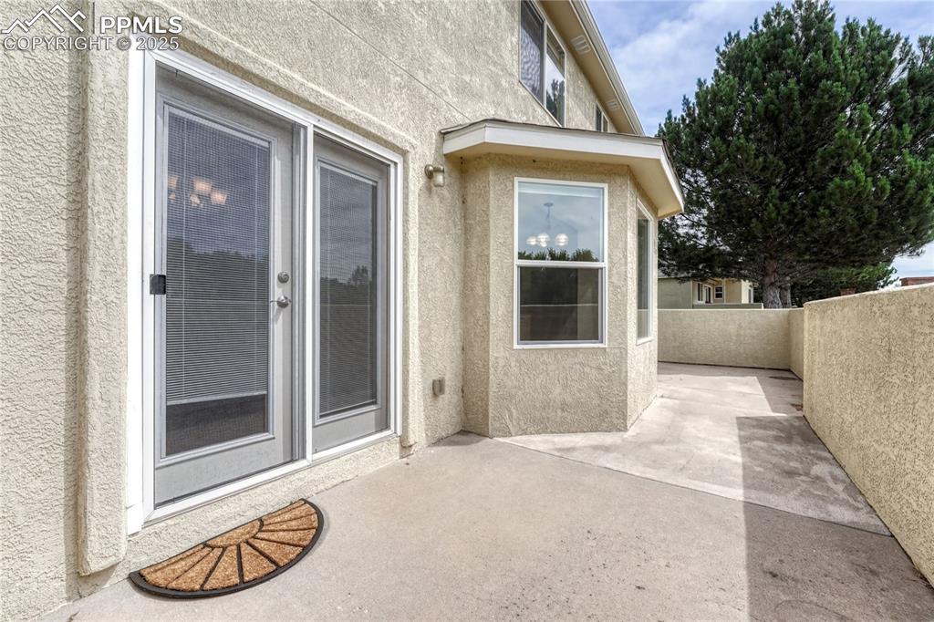 Image 36 of 47: Venture outside from the dining room to the back patio space