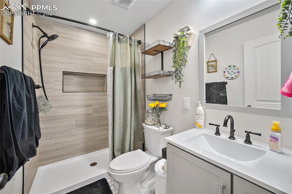 Image 38 of 50: lower level bath