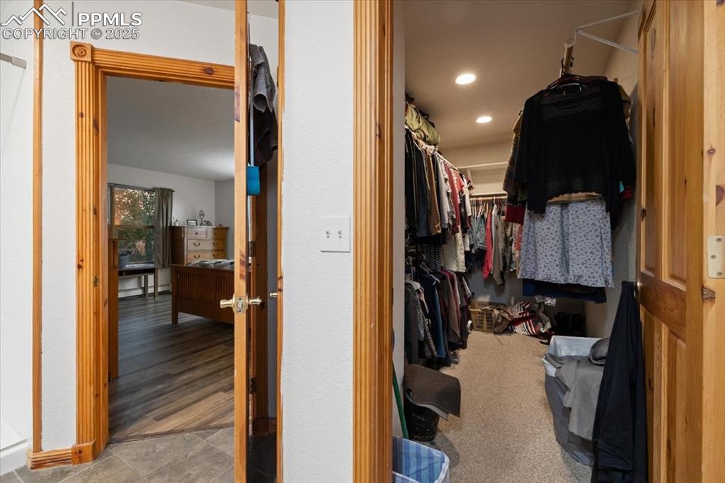 Image 38 of 47: Primary closet 