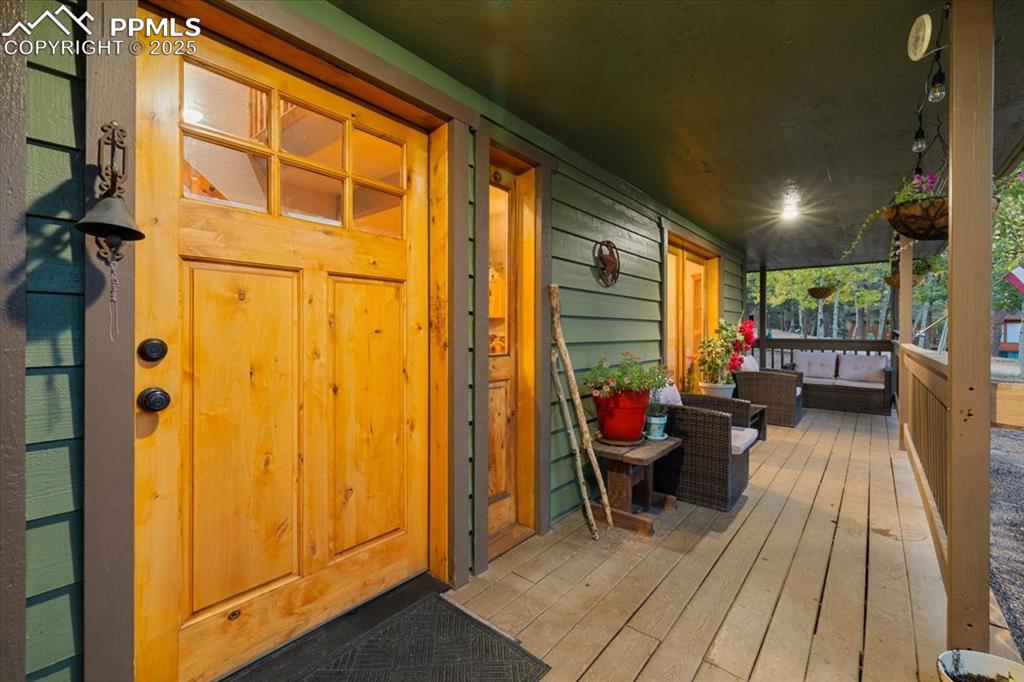 Image 9 of 47: French doors off dining room and living room open onto wrap around deck 