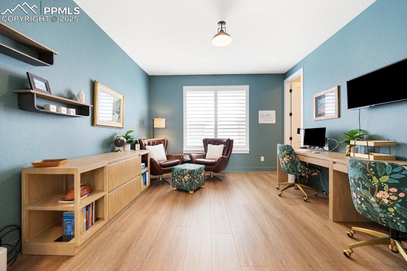 Image 21 of 49: Office with wood finished floors