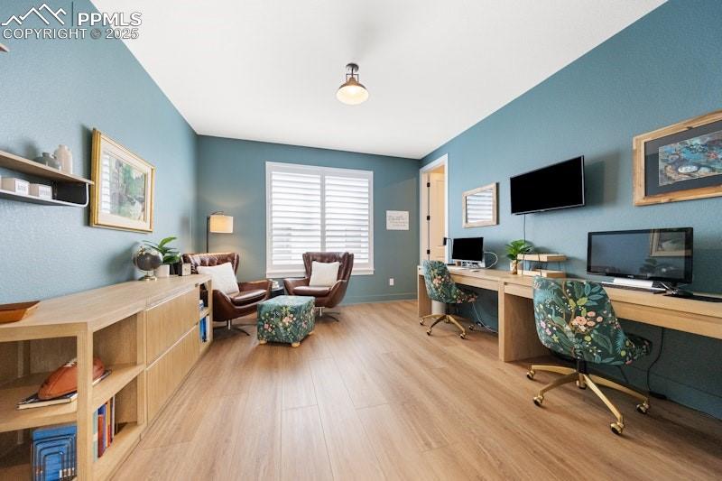 Image 22 of 49: Home office featuring wood finished floors