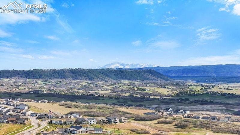 Image 47 of 49: View of mountain background featuring nearby suburban area