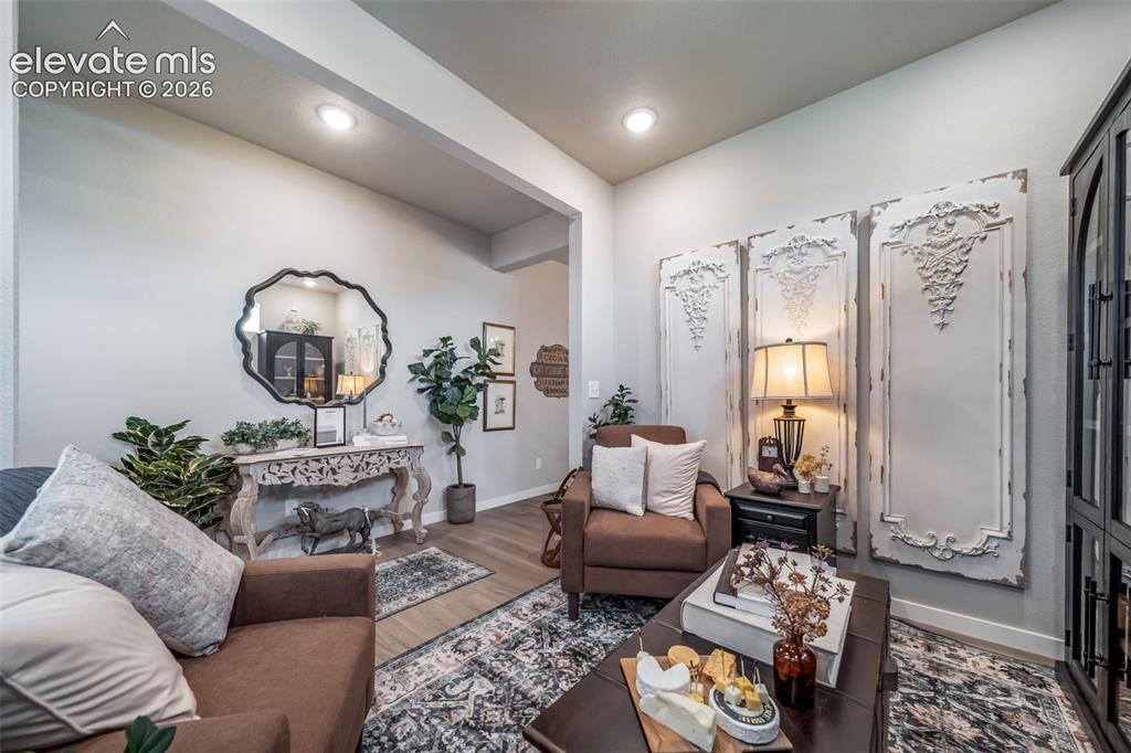 Image 18 of 45: Recessed lighting illuminates an interior space featuring light-toned walls