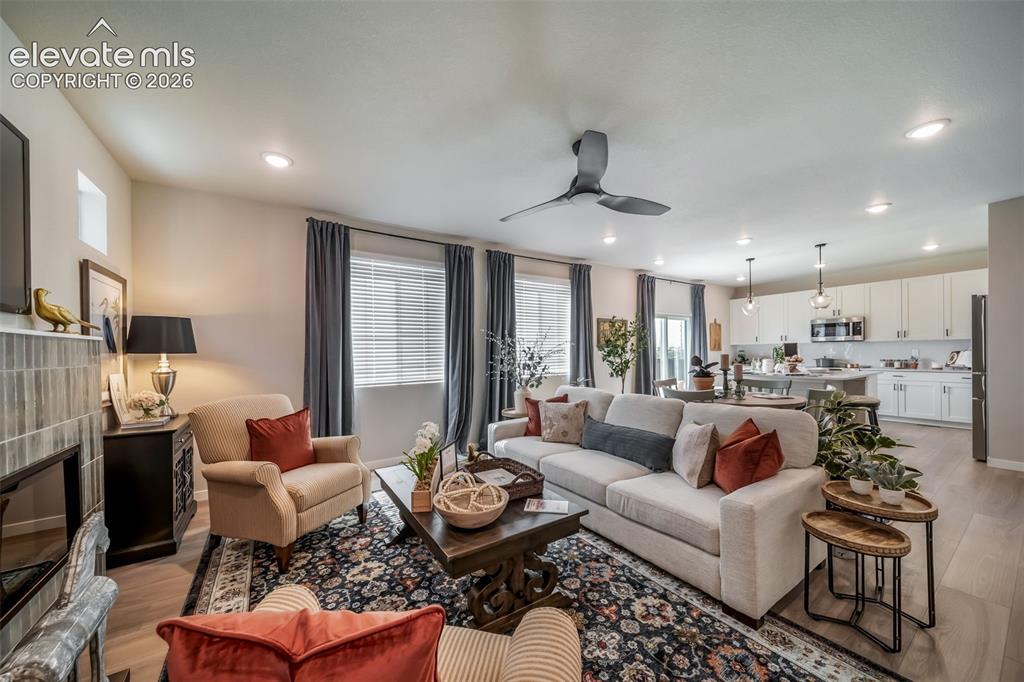 Image 24 of 45: Open-concept living area featuring light wood-finish flooring throughout
*