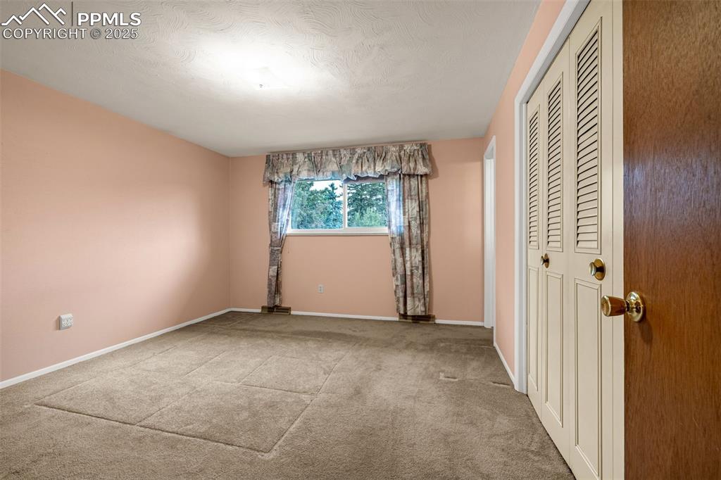 Image 11 of 19: Master bedroom with generous closet space and three-piece bathroom attached