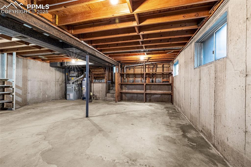 Image 17 of 19: Basement with gas water heater, gas furnace and approximately 530 square fe