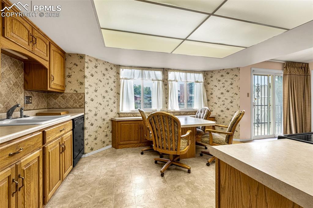 Image 7 of 19: Alternate view of kitchen featuring breakfast eating area, healthy amount o