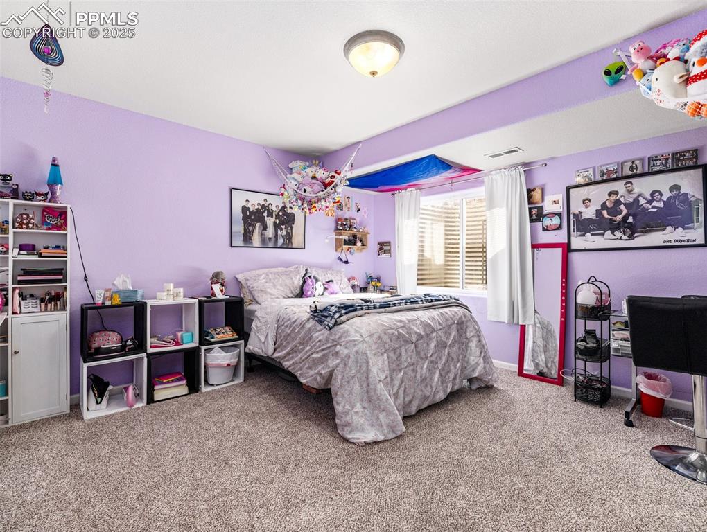 Image 29 of 48: Bedroom featuring carpet flooring and baseboards