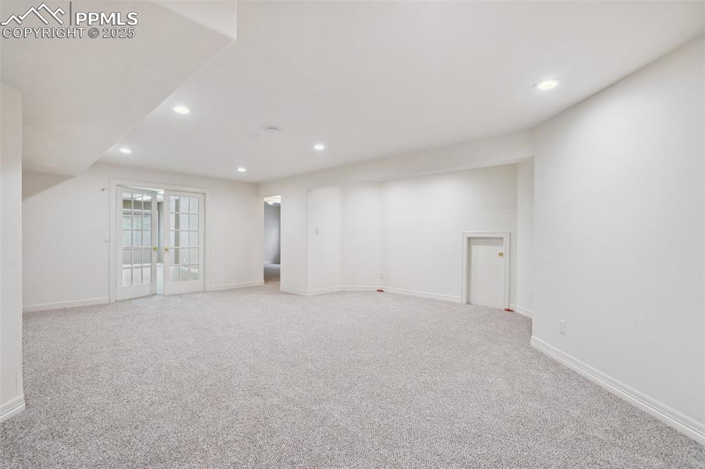 Image 24 of 49: Spare room featuring recessed lighting and carpet