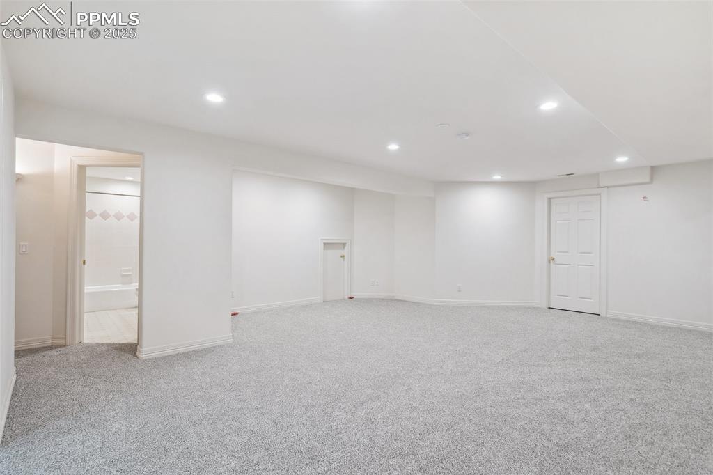 Image 26 of 49: Finished below grade area featuring baseboards, recessed lighting, and ligh
