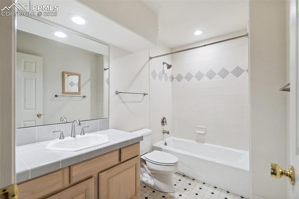 Image 31 of 49: Bathroom featuring shower / bathing tub combination, toilet, recessed light
