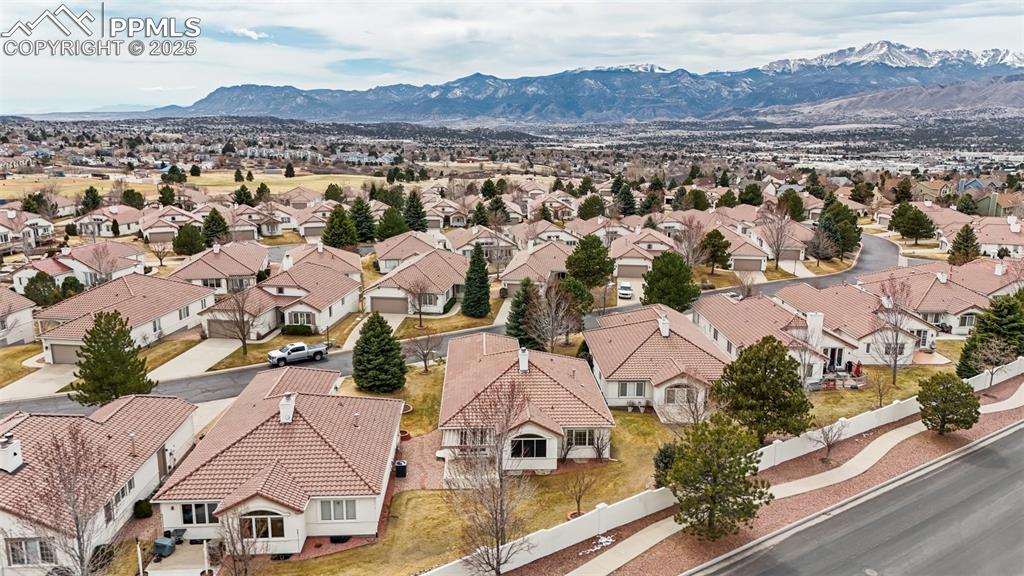 Image 38 of 49: Drone / aerial view with a mountain view and a residential view