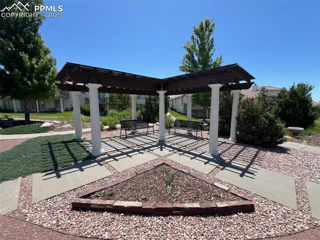 Image 46 of 49: View of patio featuring a pergola