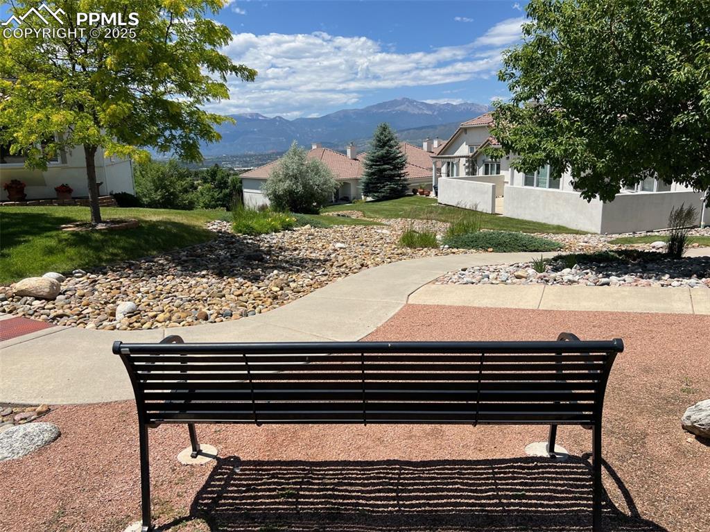 Image 49 of 49: Surrounding community with a mountain view and a lawn