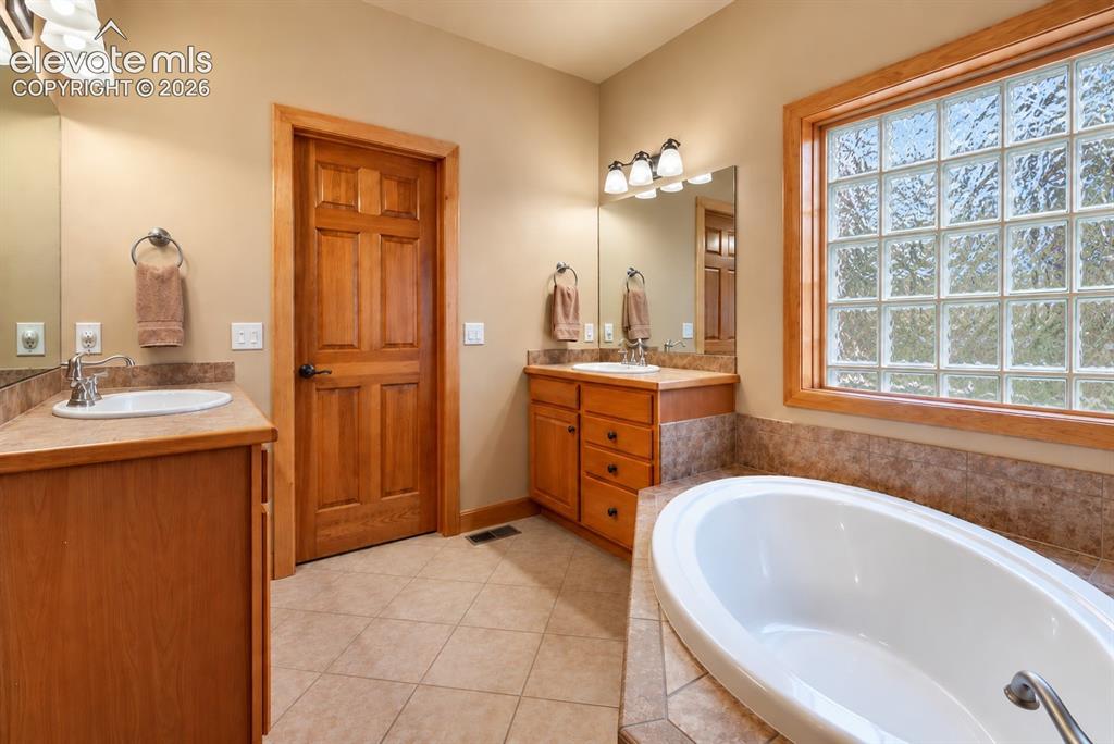 Image 11 of 24: Primary Bath with soaking tub. 