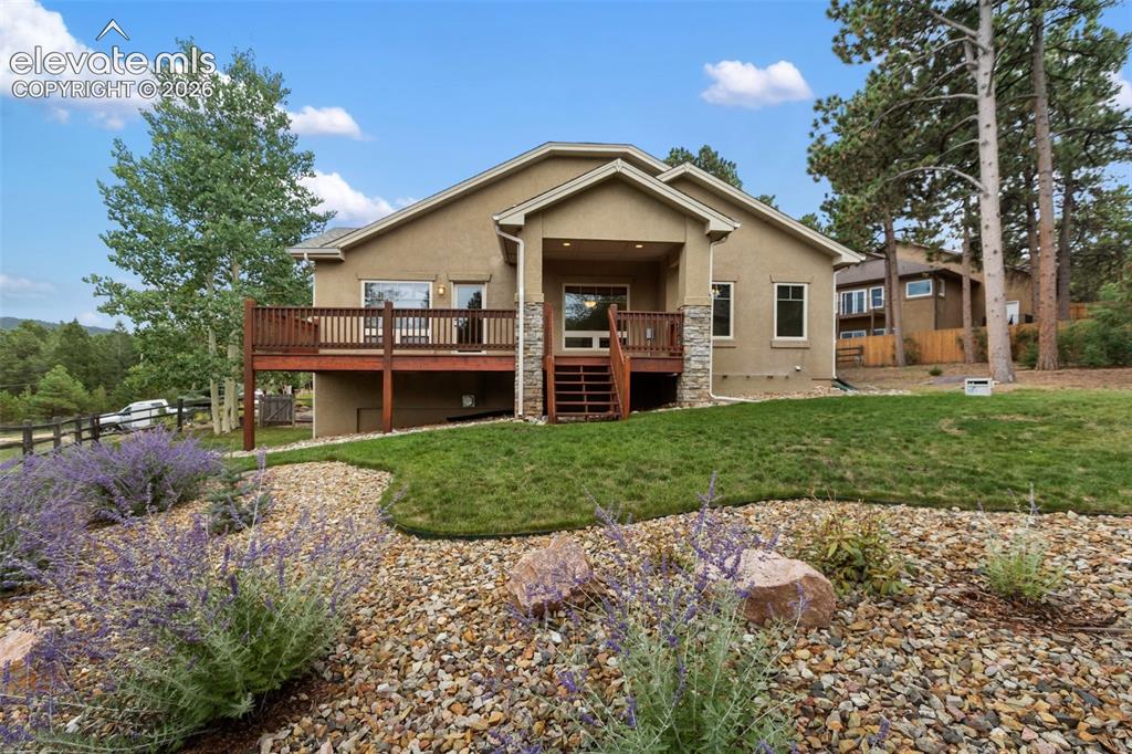 Image 2 of 24: Beautiful landscaping in the back yard as well. 