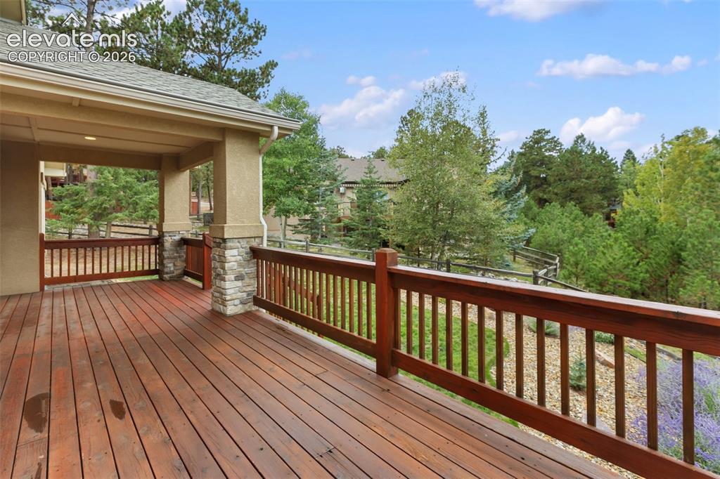 Image 20 of 24: Back open and covered deck. 