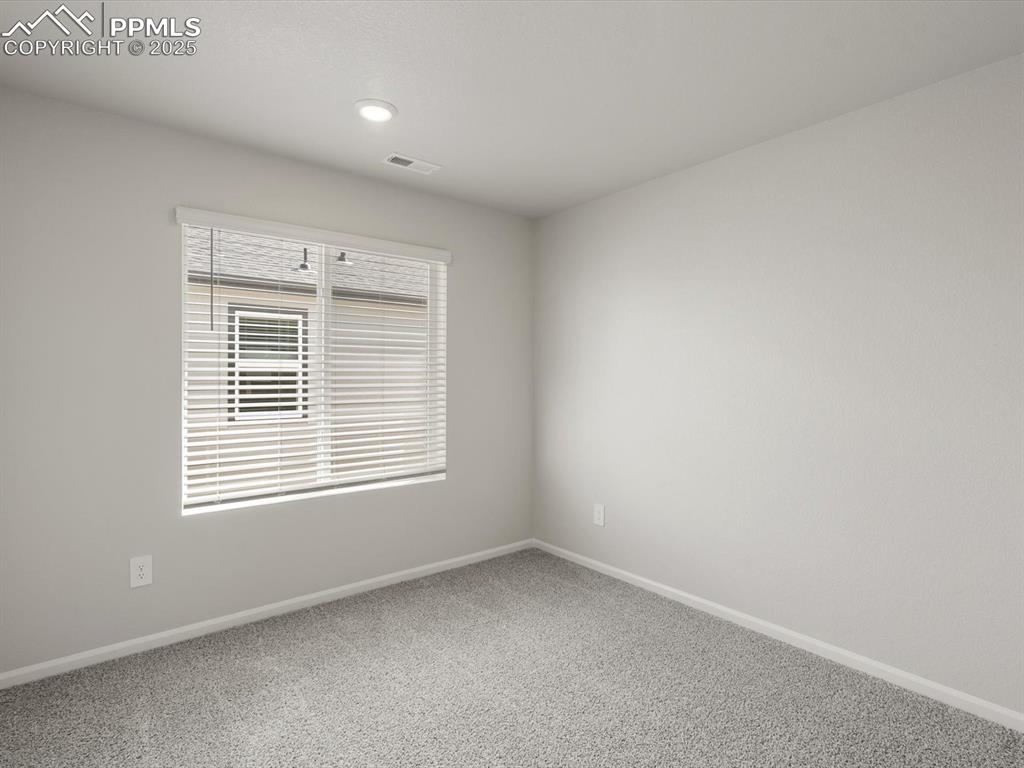 Image 15 of 30: Unfurnished room featuring carpet and recessed lighting