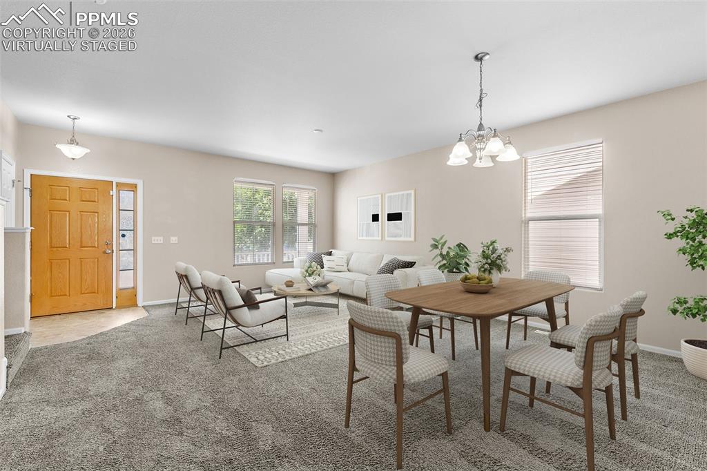 Image 4 of 38: *Virtually Staged* Dining room featuring carpet and a chandelier