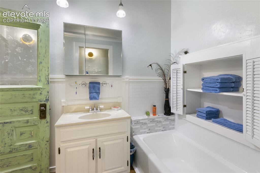 Image 35 of 43: counter space nice sink with cabinets underneath