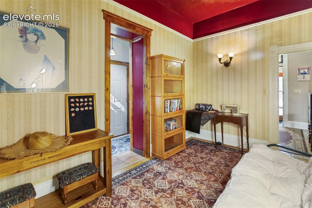 Image 37 of 43: a bedroom, egress through a window in the door to the Foyer, and by the doo
