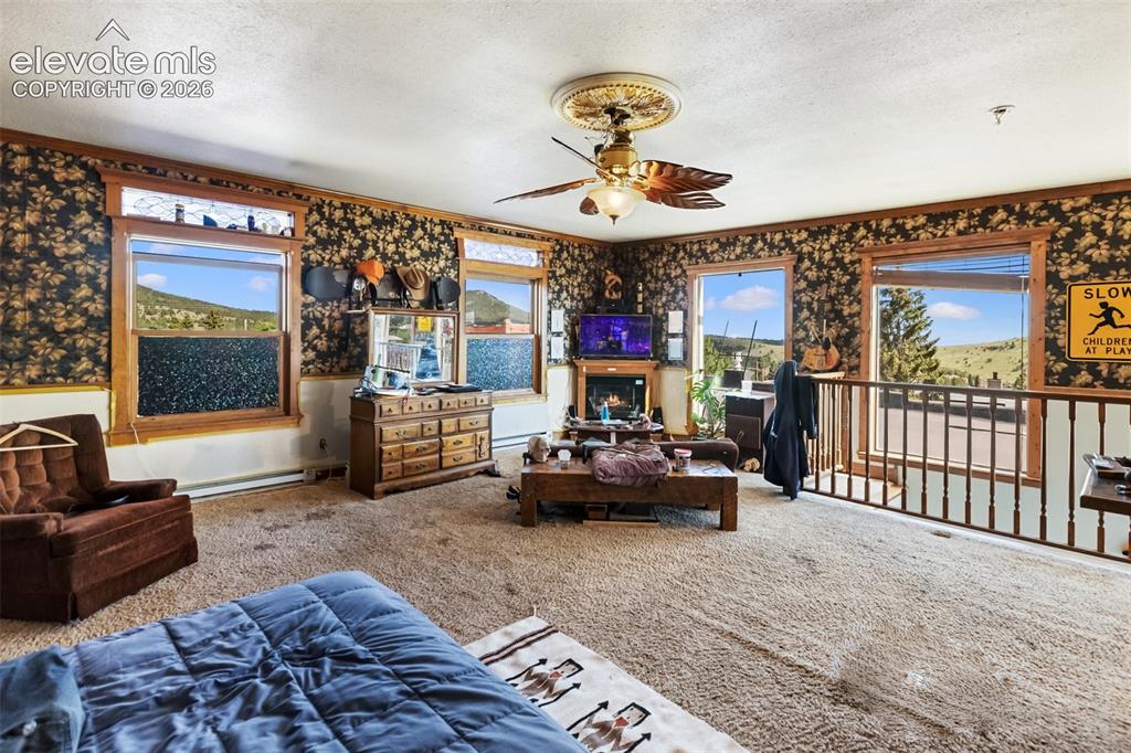 Image 40 of 43: here is the very large upstairs bedroom, really a bedroom/living room combo