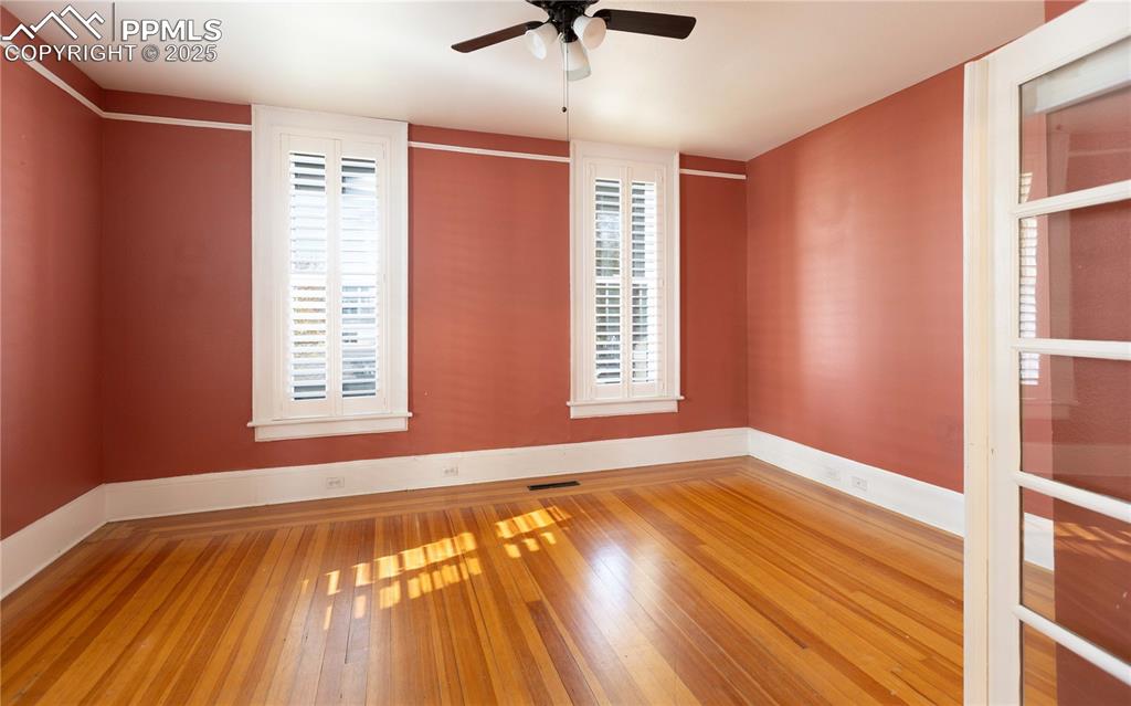 Image 9 of 31: Empty room featuring light wood-style flooring and a ceiling fan