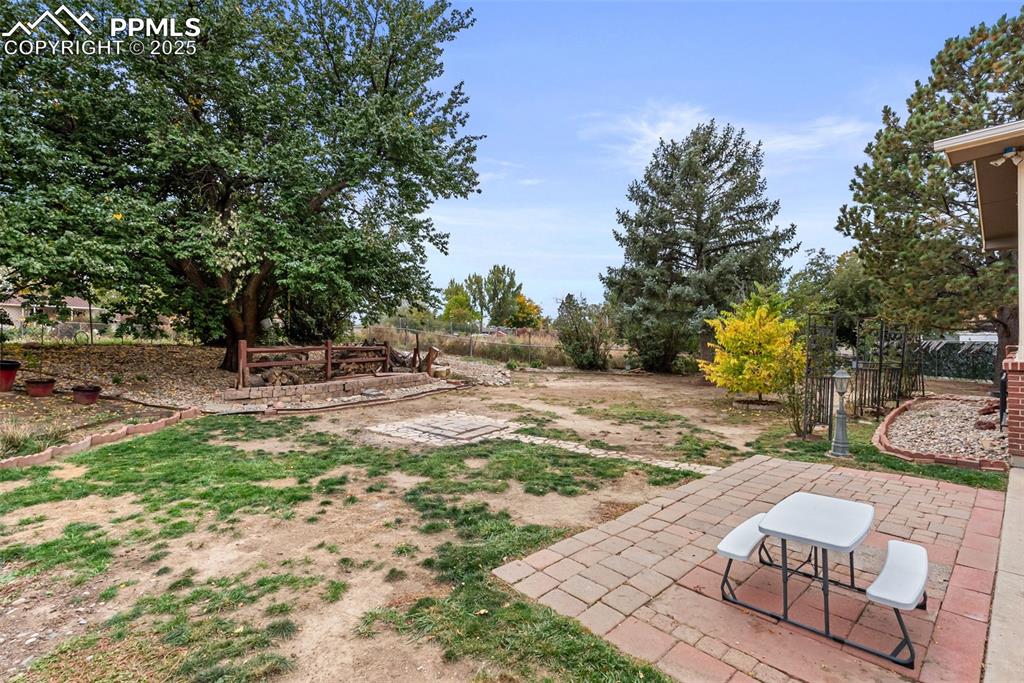 Image 49 of 50: View of yard with a patio
