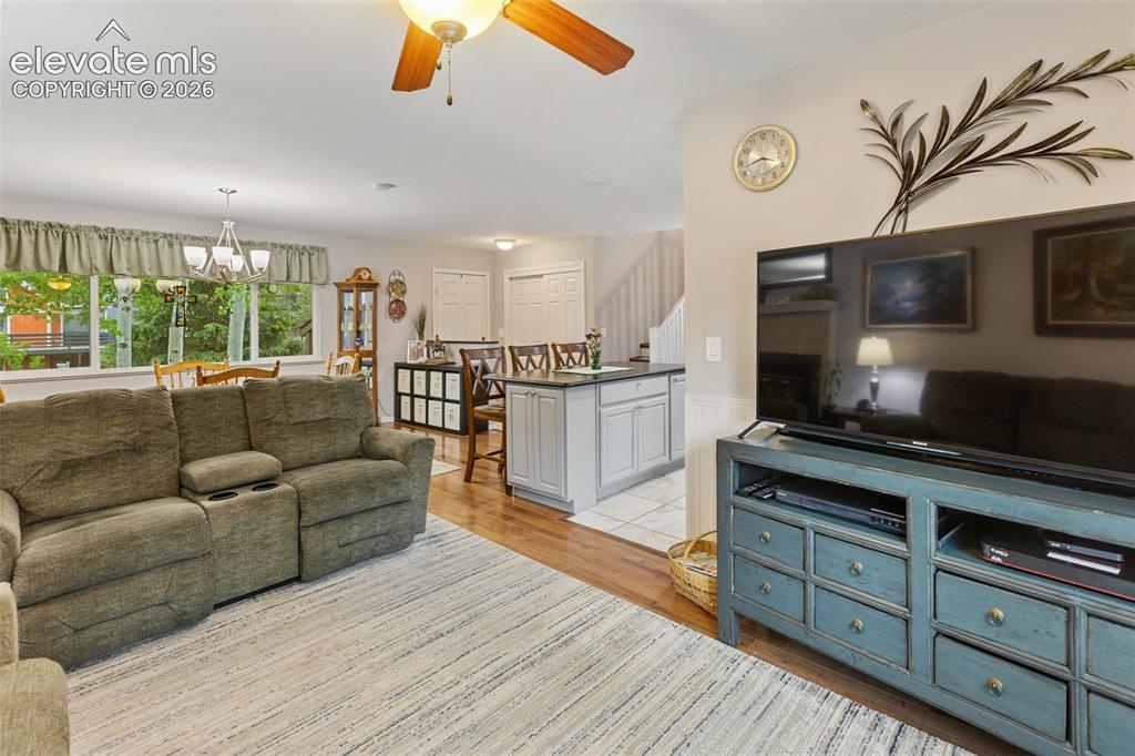 Image 6 of 29: Living Room and Kitchen, walk out deck.