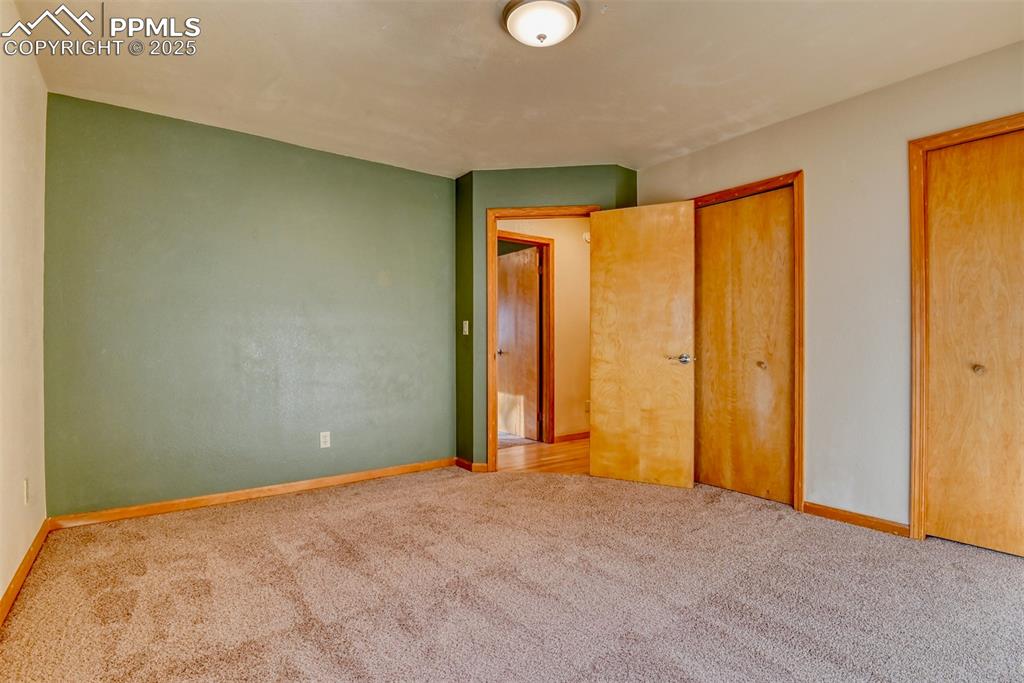 Image 12 of 23: The second main-level bedroom