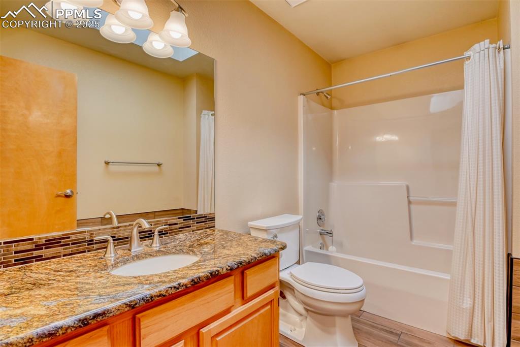 Image 15 of 23: Upper bathroom Bathroom featuring shower / tub combo--check out the tile de