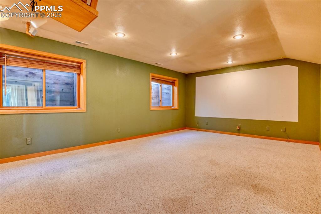 Image 16 of 23: Walk-out basement movie room