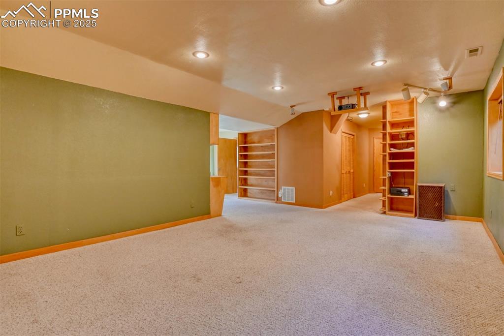 Image 17 of 23: Built-in desk, bookcase and media center, plus wired for 5.1 sound system