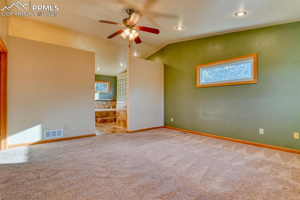 Image 6 of 23: Large Master bedroom with vies of Pikes Peak