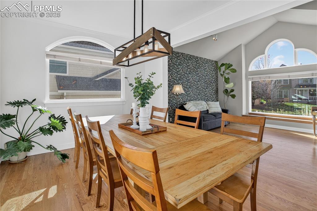 Image 11 of 47: Dining room opens to kitchen and nook or sitting area