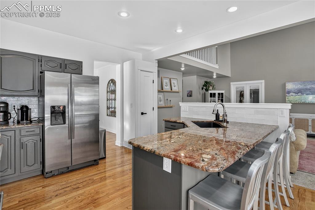 Image 15 of 47: Remodeled kitchen includes scratch resistant, crushed granite oversized sin